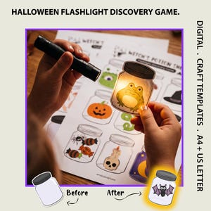 May include: A Halloween flashlight discovery game featuring a printed sheet with illustrations of jars containing items like a frog, pumpkin, skull, and spider. A black flashlight illuminates a jar cutout showing a frog, with text labels.