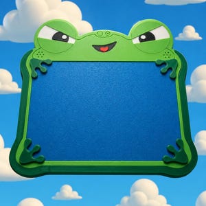 May include: A rectangular drawing board with a bright green plastic frame shaped like a frog. The frog features large white eyes with black pupils, a small smiling mouth with a red tongue, and four green frog feet at the corners. The centre is blue.