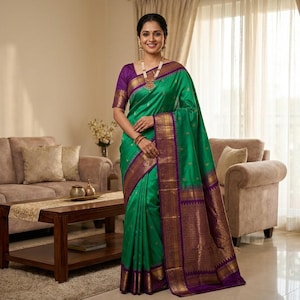 May include: A woman wearing a vibrant green sari with purple and gold accents. The sari features intricate patterns and a contrasting purple border. The woman is also wearing gold jewelry and a purple blouse. The sari is a traditional Indian garment.
