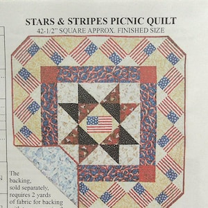 May include: A Stars & Stripes picnic quilt pattern. The quilt is approximately 42.5 inches square when finished. The design features American flags, stars, and patriotic colors of red, white, and blue. The pattern includes instructions for the backing.