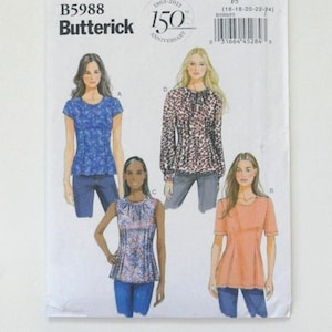 Könnte beinhalten: Ein Butterick-Schnittmuster, B5988, mit Abbildungen von vier verschiedenen Oberteilen. Das Muster enthält die Größen 16-18-20-22-24. Das Cover trägt den Text "150 Anniversary".