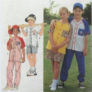 May include: A vintage sewing pattern featuring children's baseball uniforms. The illustrations show a red and white striped baseball uniform, a white baseball shirt with blue sleeves, and a yellow top with a checkered skirt. The children are wearing baseball caps and holding bats.