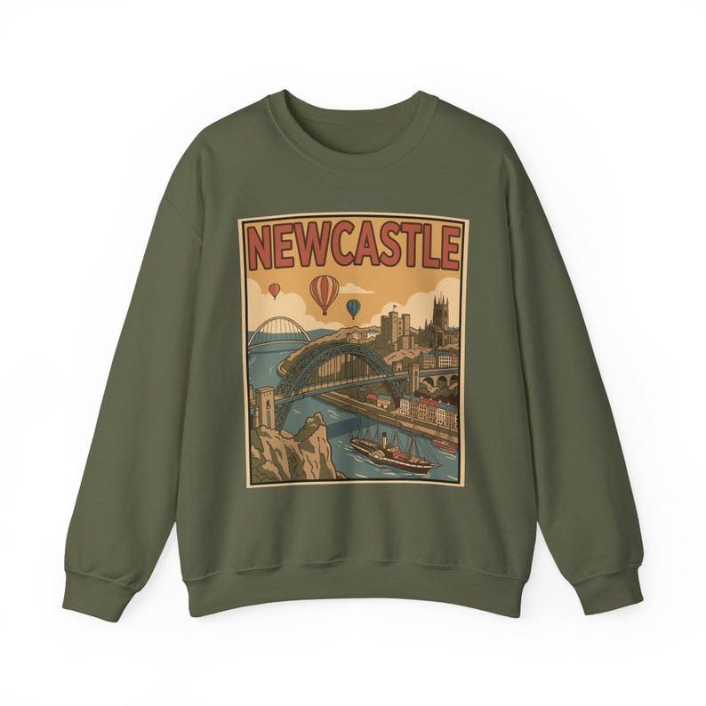 May include: Olive green sweatshirt featuring a vintage-style graphic of Newcastle, England. The design includes a bridge, buildings, hot air balloons, and the word "NEWCASTLE" in a rectangular frame. A stylish and comfortable garment for fans of the city.