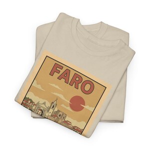 Close-up of a retro city illustration tee showing the Faro Cathedral in mid-century travel art style.