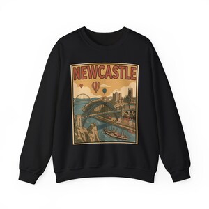Front view of a unisex cotton-poly sweatshirt with a travel poster design of the Newcastle skyline and architectural bridges.