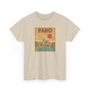 A 100 percent cotton t-shirt featuring a vintage travel poster illustration of Faro Portugal with the Arco da Vila.
