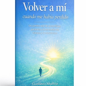 May include: A book cover with the title "Volver a mí" in white, above the phrase "cuando me habia perdido." The cover features a person walking on a path toward a bright light. Author's name is Gustavo Muñoz.
