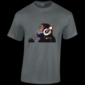 May include: A dark grey t-shirt featuring a colourful graphic of a gorilla wearing headphones. The gorilla's face is a mix of bright colours, including red, blue, green, and yellow.