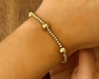 Pulseira elástica com contas em ouro 18K: Joias delicadas e minimalistas