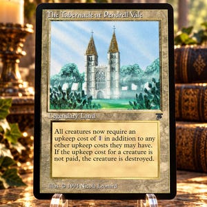 Puede incluir: Una carta coleccionable rectangular titulada The Tabernacle at Pendrell Vale, con una ilustración de una catedral de piedra con dos torres. El texto dice Legendary Land y describe un coste de mantenimiento para criaturas. Fechada en 1994.