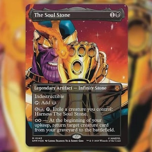 May include: A rectangular trading card titled The Soul Stone featuring a purple-skinned character wearing a gold gauntlet with glowing gems. The card text includes Legendary Artifact, Infinity Stone, Indestructible, and game mechanics.