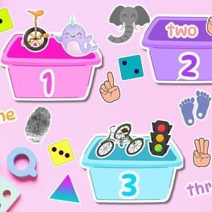 May include: Colorful stickers with numbers 1, 2, and 3, each in a different colored box. The stickers feature illustrations of a unicycle, narwhal, elephant, dice, footprints, bicycle, and traffic light. The word "one", "two", and "three" are also included.
