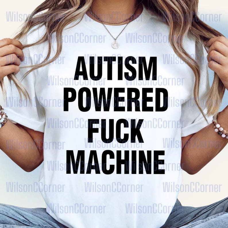 A person wearing a white t-shirt with the text "Autismpowered fuck machine" printed on it.