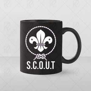 May include: Black ceramic mug with a white fleur-de-lis emblem inside a rope circle, two stars, and a knot. The word "S.C.O.U.T" is printed in white below the emblem. The mug has a black handle.