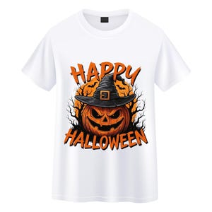 May include: White t-shirt featuring a Halloween design. The graphic includes an orange jack-o'-lantern wearing a black witch hat, with the words "HAPPY HALLOWEEN" in orange. The design is set against a dark background.