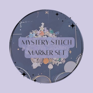May include: A collection of colorful stitch markers in various shapes and designs, arranged on a dark blue background within a circular frame. The text "MYSTERY STITCH MARKER SET" is displayed in a light purple rectangle.
