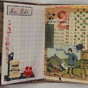 May include: Open journal with lined pages and vintage ephemera. The left page has the text "Mes Mots" and a floral design. The right page features a collage with the number "2" and a drawing of a child.