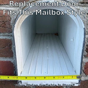 May include: An empty white mailbox interior with a rounded top and a ribbed floor. A yellow measuring tape is positioned across the front opening, showing a width of approximately 8 inches. The text reads: Replacement Door Fits This Mailbox Style.