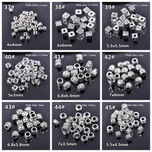 May include: Assortment of silver metal beads with various sizes and designs. The beads are arranged in rows with their size and hole size labelled. The beads are perfect for jewellery making, crafts, and other DIY projects.
