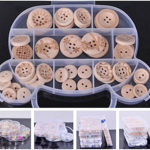 May include: A clear plastic storage box with multiple compartments filled with wooden buttons. The buttons have various designs, including floral patterns, geometric shapes, and words like "Good".