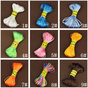 May include: Nine spools of colorful waxed cord, each wrapped in a yellow label with Chinese characters and the words "Made in China".