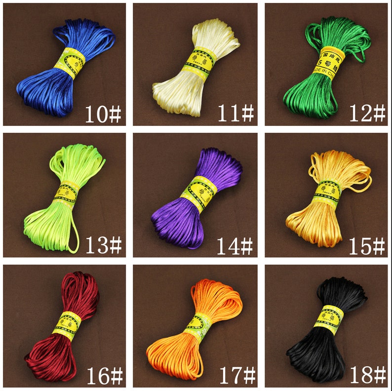 May include: Assortment of 18 colors of waxed cord, each color is wound into a coil. The cords are labeled with numbers 10 through 18.
