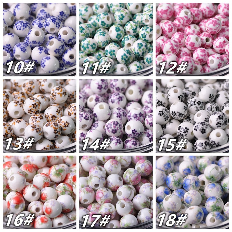 May include: Assortment of 18 ceramic beads with floral patterns. The beads are white with different colored floral designs, including blue, green, pink, purple, brown, red, and blue. The beads are numbered 10 through 18.