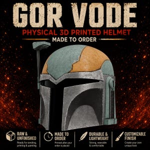 May include: A physical 3D printed helmet labeled GOR VODE, featuring a weathered green and orange finish with a metallic silver faceplate and a side-mounted antenna. The text includes PHYSICAL 3D PRINTED HELMET and MADE TO ORDER.