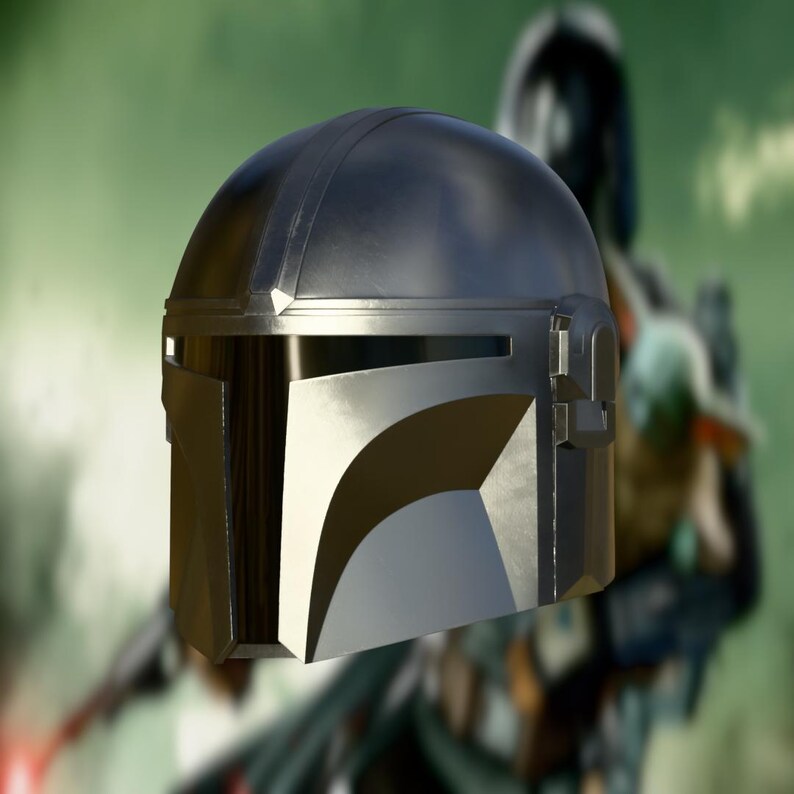 May include: A metallic silver and black Mandalorian helmet with a visor. The helmet has a rounded top with a ridge and a rectangular opening for the visor. The design is reminiscent of the Star Wars series.