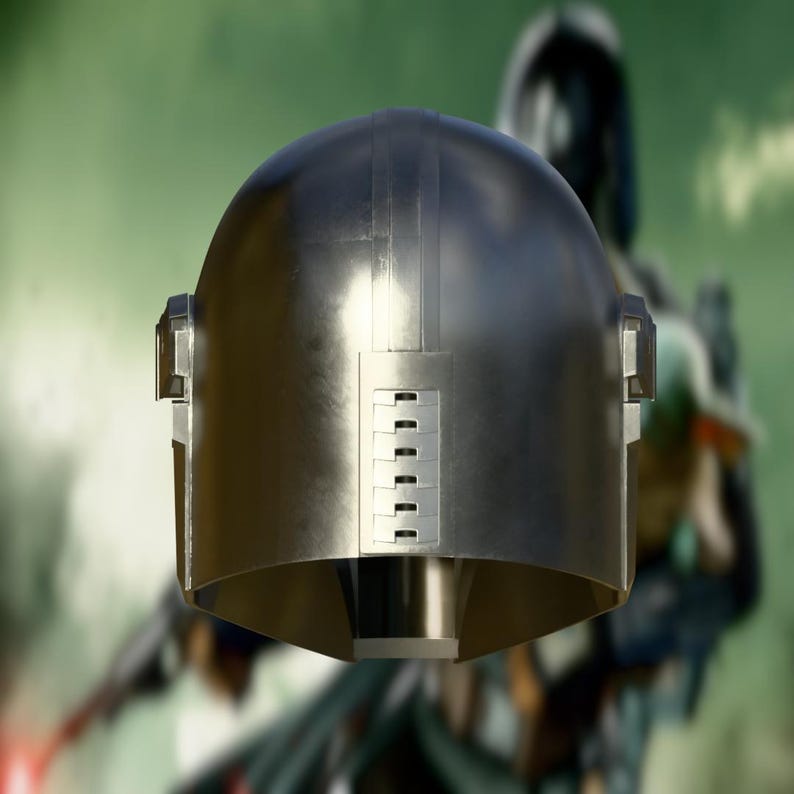 May include: A metallic silver helmet with a rounded top and a rectangular lower section. The helmet has vertical lines and a series of small rectangular cutouts. The background is blurred, suggesting a character in a costume.