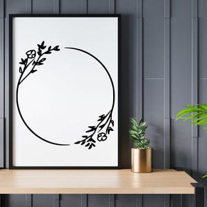May include: Black and white floral wreath with a circular frame. The wreath is made of simple line drawings of leaves and flowers.