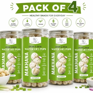May include: A pack of four clear plastic jars filled with Cream & Onion Water Lily Pops, labeled Makhana. Each jar features a green label with white text, nutritional icons, and a net weight of 3 oz (85 g). Includes a bowl of pops and onions.