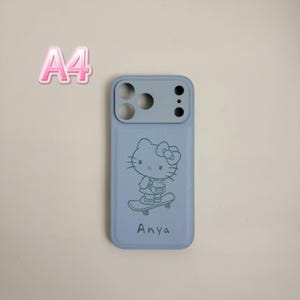 May include: A light blue phone case featuring a cartoon character on a skateboard. The case has a gray camera module and the name "Anya" printed below the character. The text "A4" is in the upper left corner.