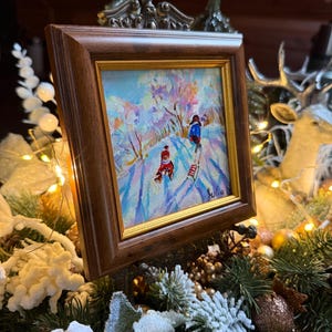 May include: A set of three ceramic mugs with a speckled, matte finish. The mugs are in shades of cream, light gray, and dark gray. Each mug has a simple, minimalist design and a rounded handle.