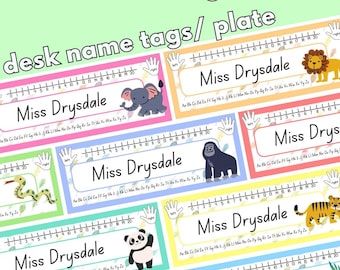 May include: Colorful desk name tags with a jungle theme. Each tag features a different animal illustration, including an elephant, lion, gorilla, snake, panda, and tiger. The tags have a ruler design and the name "Miss Drysdale".