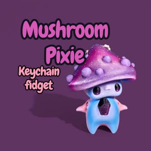 May include: A 3D-printed Mushroom Pixie keychain fidget in blue, pink, and purple. The mushroom cap is purple with glitter and round purple accents. The text "Mushroom Pixie Keychain fidget" is in pink and white.
