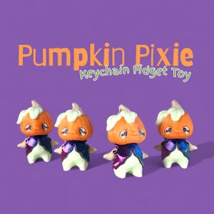 May include: Four orange Pumpkin Pixie Keychain Fidget Toys with green and white accents. Each figure has a blue and purple cape and a white base. The text "Pumpkin Pixie Keychain Fidget Toy" is above the figures.