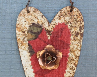 distressed white hanging heart with a copper rose and fabric heart in center