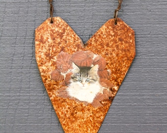 handmade hanging heart cut from distressed metal with picture of cat decoupaged on