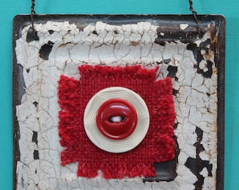 wall decor - hanging ceiling tile with red wool patch and buttons