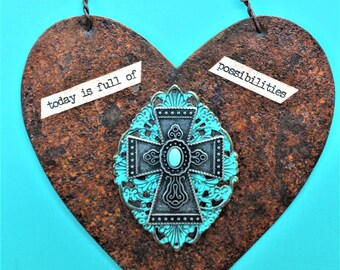 handmade hanging heart cut from distressed  galvanized tin with center piece cross with turquiose stone