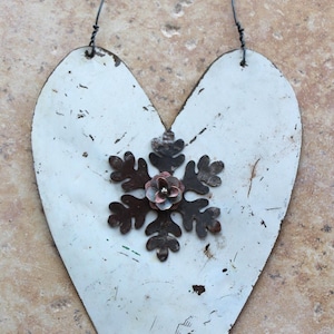 hanging heart -  distressed white metal heart with rusted snowflake and a brass flower