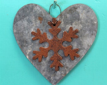 Christmas ornament - rusty snowflake on heart cut from galvanized metal