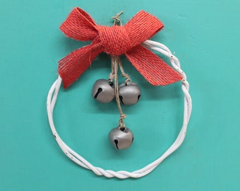 rustic Christmas ornament made from old snow fencing wire and silver metal jingle bells