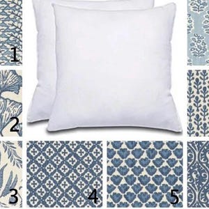 May include: A set of three ceramic mugs with a speckled, matte finish. Each mug features a different color: light blue, cream, and gray. The mugs have a simple, modern design, perfect for coffee or tea.