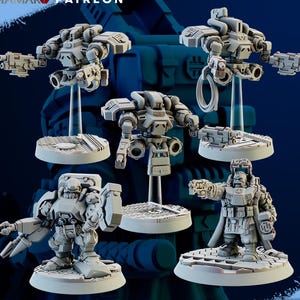 May include: Several grey miniature robot figures, each with distinct designs and weaponry, are displayed. The figures are on circular bases and appear to be 3D-printed models. The image includes the text "CHAMAKO PATREON" and "SUPPORTS READY".
