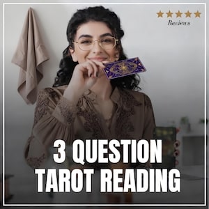 May include: A woman holding a tarot card with a purple and gold design. The card features an eye and sun design. The image has the text "3 QUESTION TAROT READING" in large white letters. The word "Reviews" is above the woman's head.