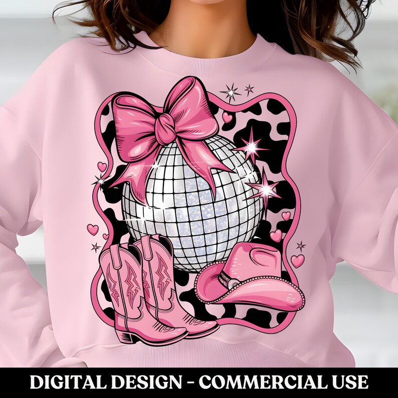 May include: Pink sweatshirt with a design featuring a disco ball, a pink bow, cowboy boots, and a cowboy hat. The design is on a black and white cow print background.