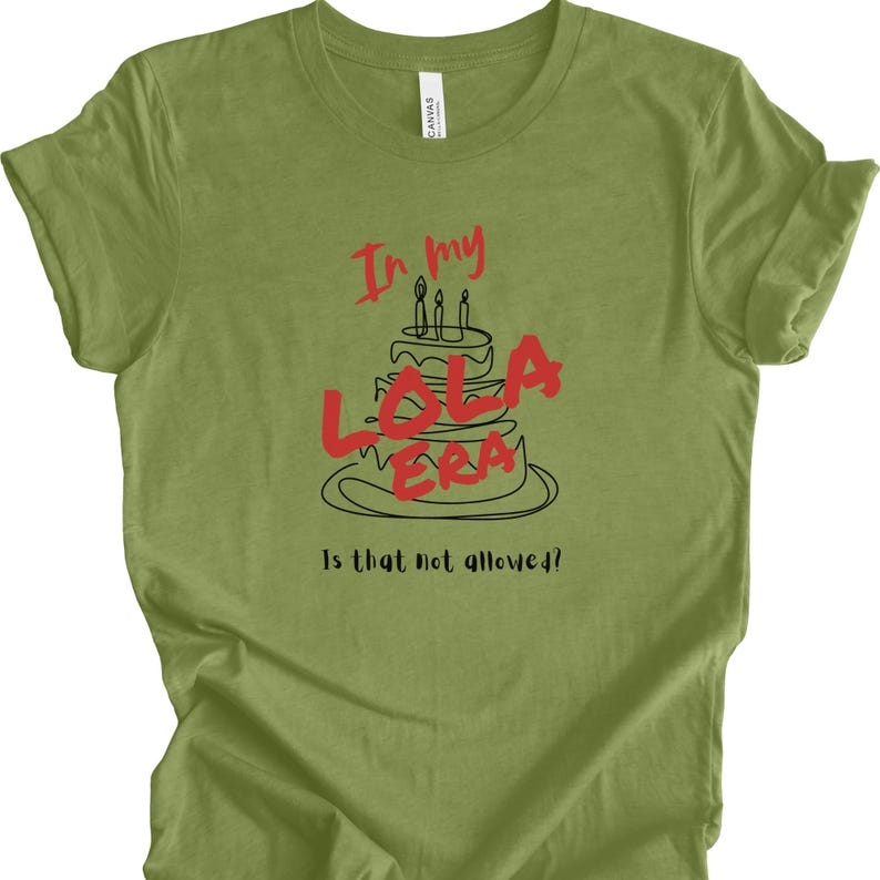 May include: Green t-shirt with a black and white illustration of a birthday cake with the words "In my Lola Era" and the text "Is that not allowed?"