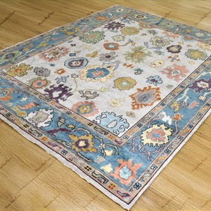 Hand-Knotted Turkish Oushak Rug: Navy Blue Floral Wool Area Rug